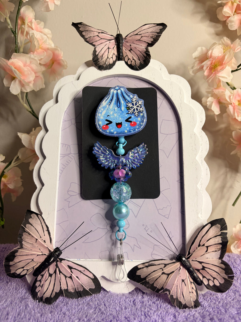 Winter Kawaii Dumpling Badge Reel with Iridescent Angel Wings & Teal Beaded Charm