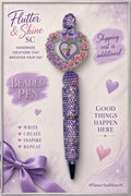 Rapunzel themed purple bling pen with sparkling barrel, purple accent beads, and a heart-shaped focal surrounded by pink and purple flowers.