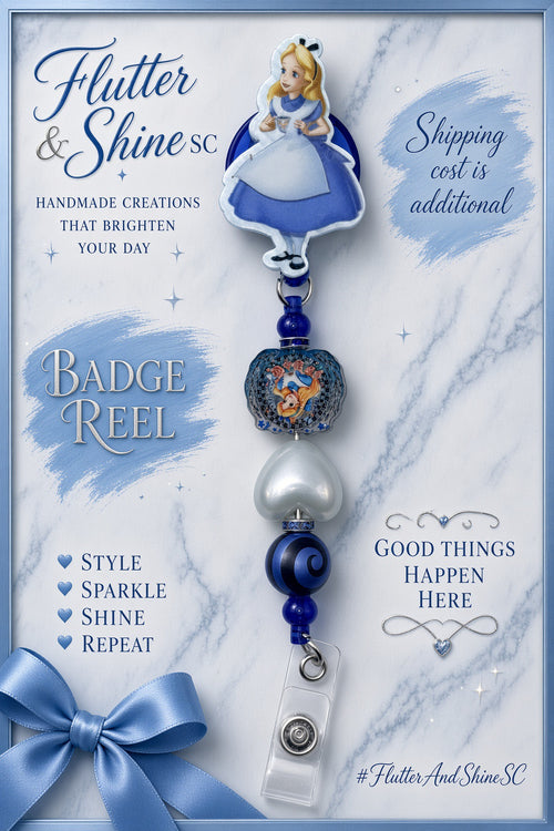 Alice in Wonderland themed badge reel with Alice topper, decorative character bead, white heart bead, blue-and-black swirl bead, small blue beads, and clear snap strap.