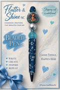Moana themed pen with deep blue sparkling barrel and top bead, aqua glitter-look bead, silver-tone round bead, and blue-green character focal.