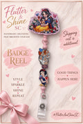 Snow White themed badge reel with pink-bordered floral character topper, dwarf character accent, Snow White holding an apple, pink bead details, and clear snap strap.