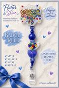Autism Mom badge reel with leopard-print and colorful puzzle-piece lettering, blue beads, blue sparkling spacers, a winged puzzle heart, purple glitter heart bead, and clear badge strap.