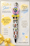 Bubbles Themed beaded pen with yellow-pigtail character face, pink star-shaped Bubbles accent, blue sparkling spacer, white Powerpuff Girls decorated barrel, and dark pointed tip.